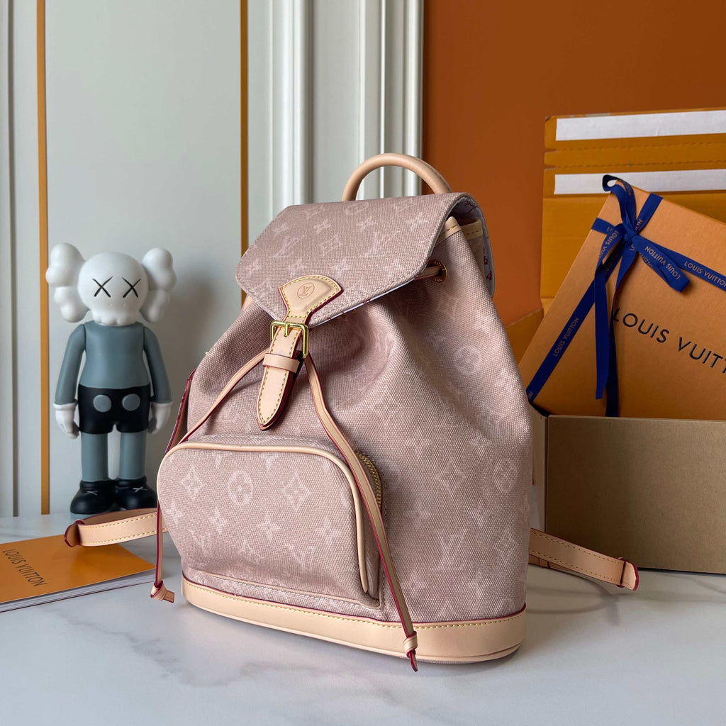 Louis Vuitton backpack with a KAWS figure and Louis Vuitton packaging in the background