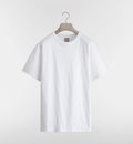 White t-shirt on a hanger against a light gray background
