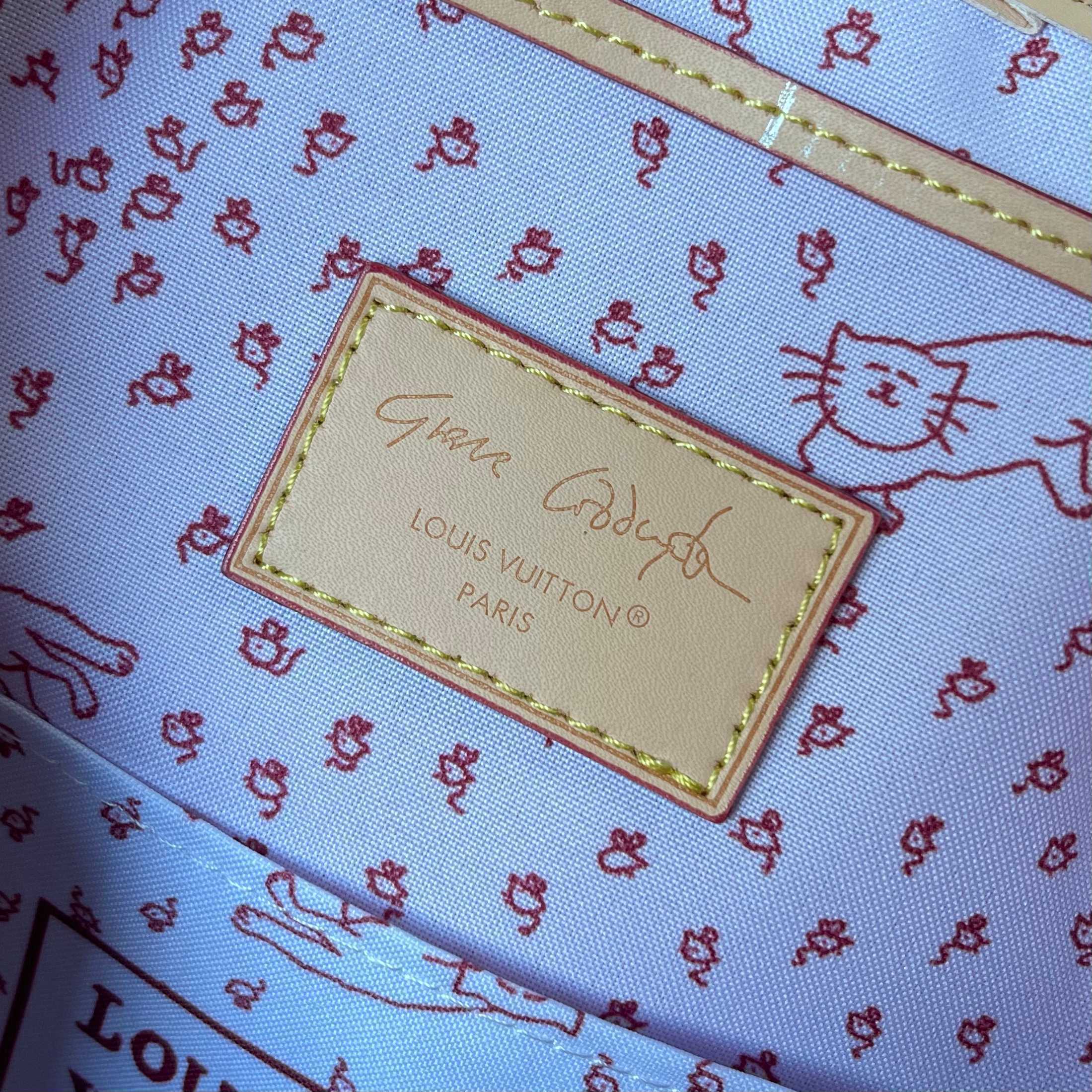 Louis Vuitton bag with cat pattern and signature label