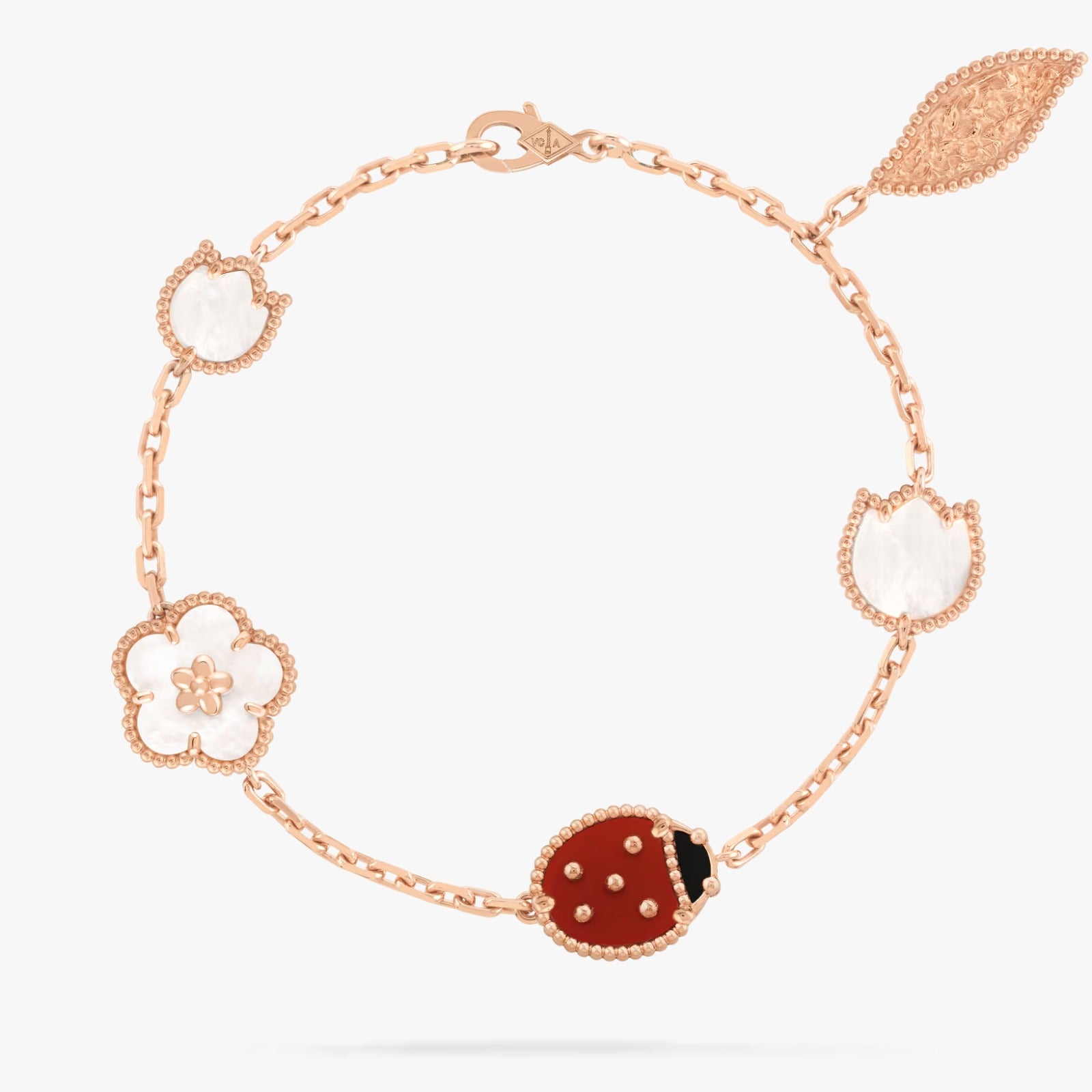 Rose gold bracelet with ladybug charm on a white background